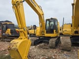 2023 Komatsu PC138US crawler excavator, front three-quarter view
