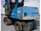 2010 Fuchs MHL320 material handler, rear three-quarter view