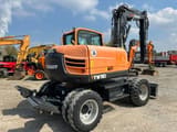 2020 Yanmar TW 110 wheel excavator, rear three-quarter view