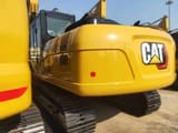 2026 Caterpillar 320GX crawler excavator rear three-quarter view