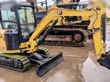 2025 Caterpillar 303CR mini excavator, front three-quarter view