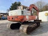 1985 Poclain 75CKB crawler excavator, rear three-quarter view