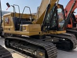 2023 Caterpillar 320GC crawler excavator, side view