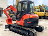 2021 Kubota U55-5 mini excavator, rear three-quarter view