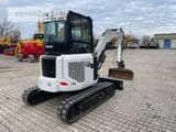 2022 Caterpillar 303.5CR-07 mini excavator, rear three-quarter view