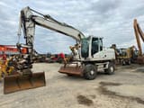 2009 Caterpillar M316D wheel excavator, side view