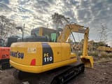 Komatsu PC110 crawler excavator, rear three-quarter view