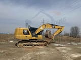 Caterpillar 320GC crawler excavator, side profile view