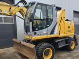 2011 New Holland WE150C wheel excavator, front three-quarter view