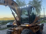 2006 CASE WX145 wheel excavator, front three-quarter view