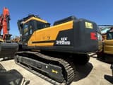 2024 Hyundai HX340HD crawler excavator, rear three-quarter view