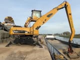 2008 Caterpillar M325D material handler, rear three-quarter view