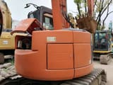 2023 Hitachi ZX75UR excavator rear view with engine cover open