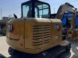 2023 Caterpillar 305.5 mini excavator, rear three-quarter view