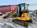 2018 Caterpillar 303.5ECR mini excavator, rear three-quarter view