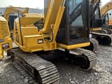 2024 Komatsu PC70-8 mini excavator, rear three-quarter view