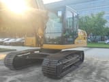 2025 Caterpillar 320GX crawler excavator, front three-quarter view
