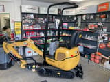 2022 Caterpillar 300.9D mini excavator, side view