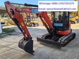 2023 Kubota KX057-4 mini excavator, front three-quarter view