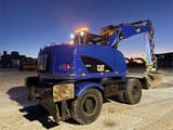 2014 Caterpillar M313D wheel excavator rear three-quarter view