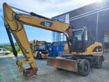 2009 Caterpillar M315D wheel excavator, front three-quarter view