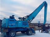 2010 Fuchs MHL350 material handler, side profile view