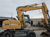 2010 Liebherr A314 wheel excavator, side profile view