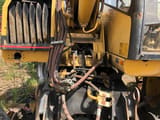 1999 Caterpillar M312 wheel excavator side view of hydraulic connections