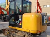 2020 Caterpillar 305.5E mini excavator, rear three-quarter view