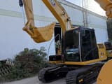 2021 Caterpillar 313D2 GC crawler excavator, front three-quarter view