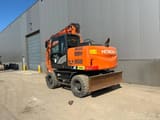 2015 Hitachi Zaxis 140W wheel excavator, rear three-quarter view