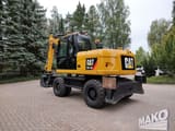 2012 Caterpillar M313D wheel excavator, rear three-quarter view