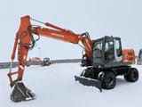 2010 Hitachi Zaxis 140W wheel excavator, side profile view