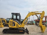 2022 Komatsu PC-55MR mini excavator, side profile view