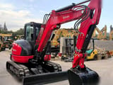 2023 Kubota KX057-4 mini excavator, rear three-quarter view