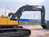 Volvo EC240 crawler excavator, side profile view