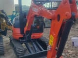 2022 Kubota U27 mini excavator, front three-quarter view