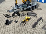 Berger Kraus BK1250JS mini excavator on trailer with attachments