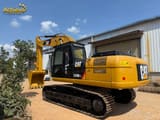 2025 Caterpillar 329D2L crawler excavator, rear three-quarter view