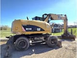 2009 Caterpillar M318D wheel excavator, side profile view
