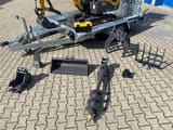 Berger Kraus BK1000JS mini excavator with attachments on trailer