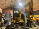 2019 Caterpillar 302CR mini excavator, front three-quarter view