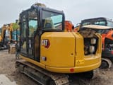 Caterpillar 307E mini excavator, rear three-quarter view