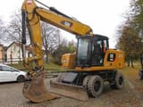 2021 Caterpillar M320 VAH wheel excavator, front three-quarter view