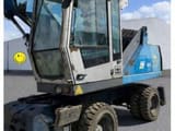 2010 Fuchs MHL320 material handler, front three-quarter view