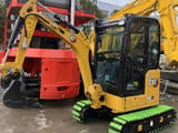 2024 Caterpillar 302CR mini excavator, front three-quarter view