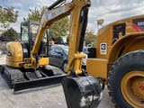 2023 Caterpillar 304CCR mini excavator, front three-quarter view