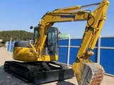 2023 Komatsu PC78US-6 mini excavator, front three-quarter view