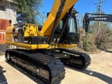 2020 Caterpillar 320DL koparka gąsienicowa, widok z tyłu pod kątem
