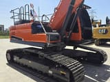 2023 Doosan DX300LC excavator, rear three-quarter view